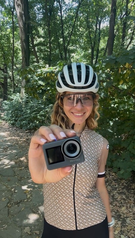 Diana holding an Akaso camera